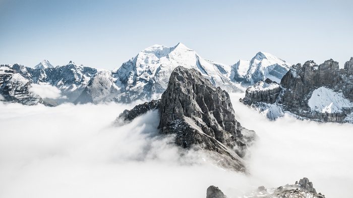 Snow mountains above clouds in Switzerland 4K