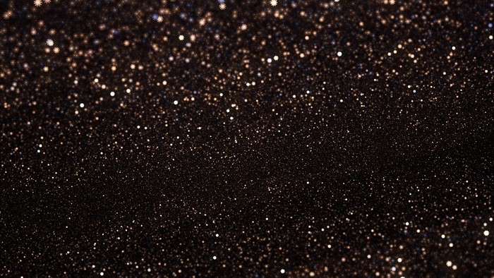 Glittering particles on a dark background