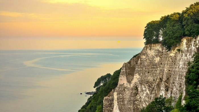 White cliffs overlooking the sea at sunset