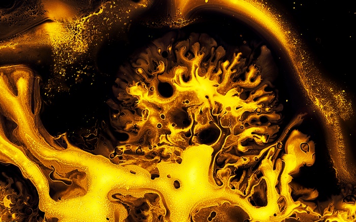 Abstract yellow ink art with black background