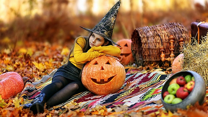 Girl in Witch Hat with Jack-o'-lantern