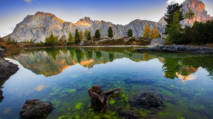Mountain lake reflection with autumn trees