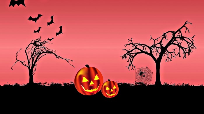 Halloween scene with pumpkins, bats, and spider