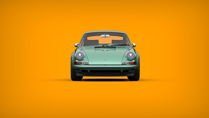 Green Porsche 911 on orange background