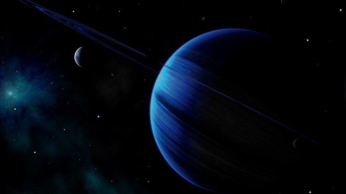 Blue planet with rings and moons in space