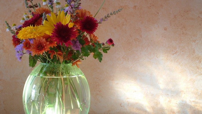 Still life of colorful flowers in a glass vase