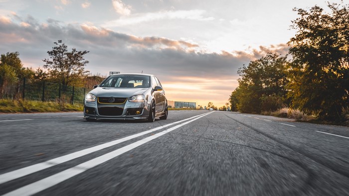 Volkswagen Golf 5 on a Road at Sunset