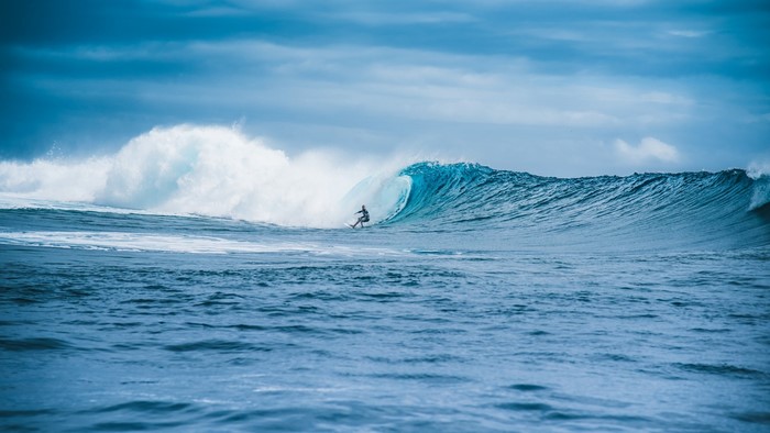 Surfer riding a large wave