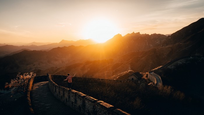 Man on Great Wall during sunset