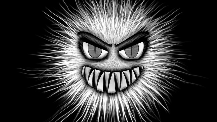 Scary fuzzy monster emoticon with sharp teeth