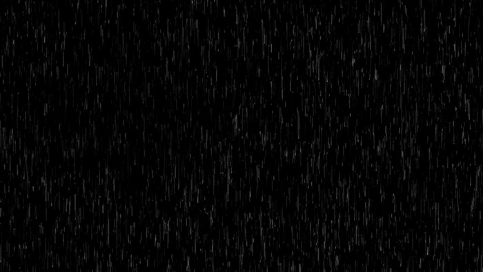 Rain falling on a black background