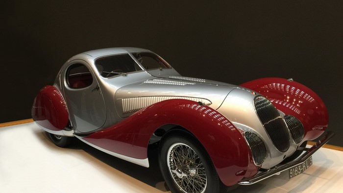 Silver and red vintage coupe car