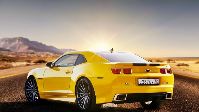 Yellow Chevrolet Camaro on a Desert Road