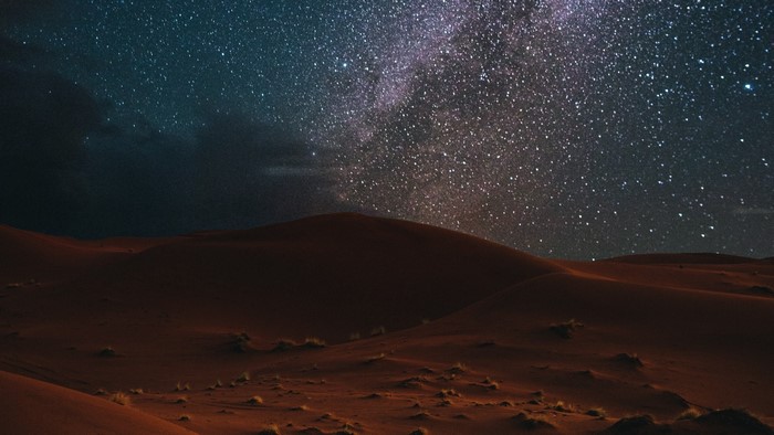 Desert Dunes Under a Starry Night Sky