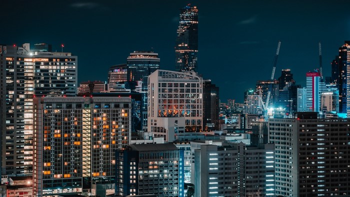 Night city skyline with illuminated skyscrapers