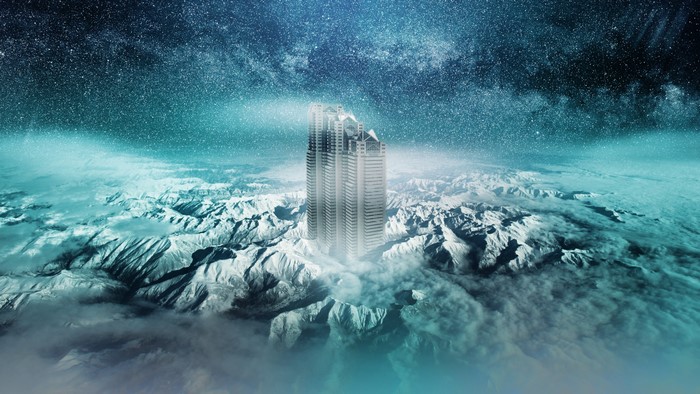 4K Skyscraper in Snowy Mountains Under Stars