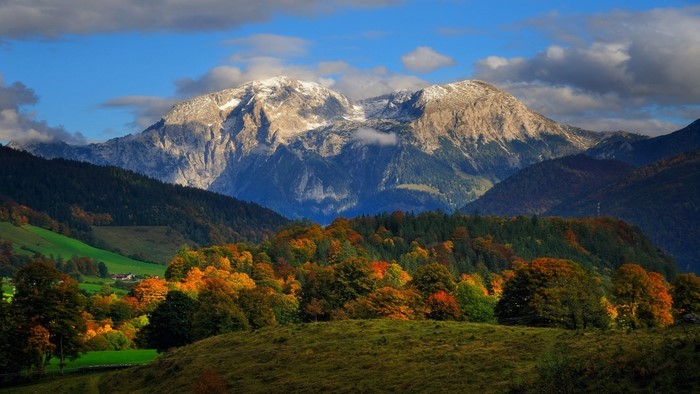 Autumn mountain landscape with snow-capped peaks