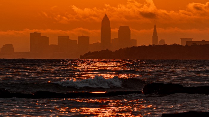 Cleveland skyline at sunset over Lake Erie