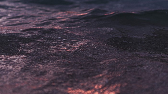 Close-up of dark purple water waves