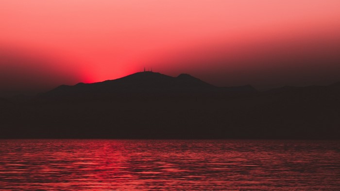 Sunset over mountains and sea