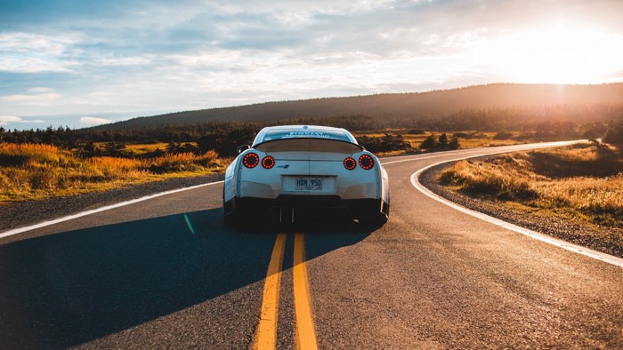 Nissan GT-R on a Winding Road at Sunset