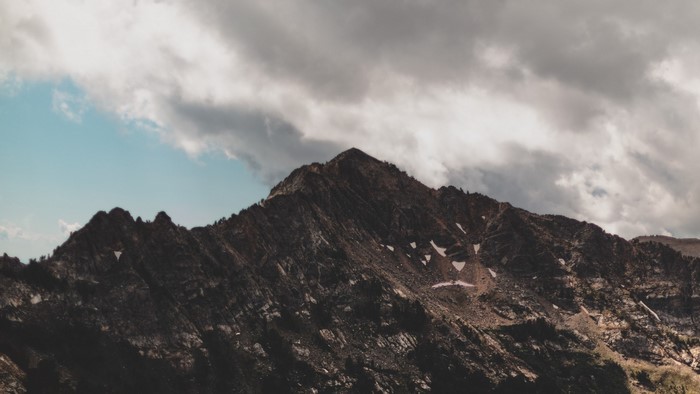 Mountains under cloudy sky