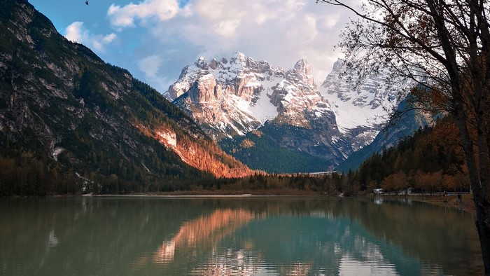 Lake and snow-capped mountains at sunset