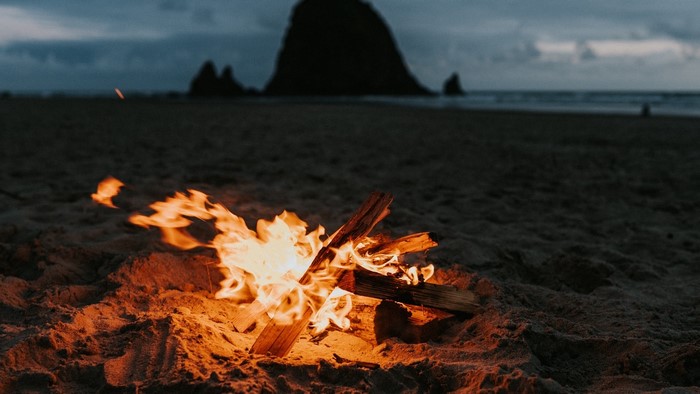 Bonfire on a beach at dusk