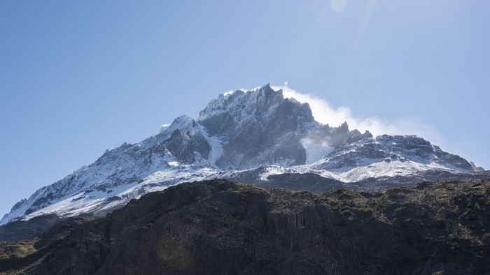 Snow-capped mountain peak under a clear blue sky