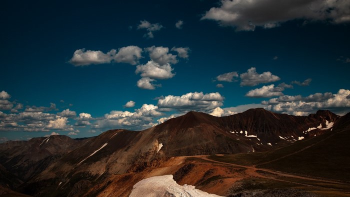 Mountains and clouds under a blue sky