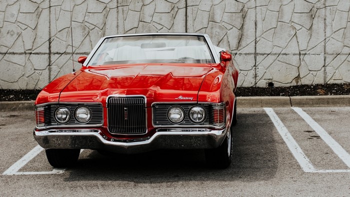 Red Mercury Cougar Convertible Parked