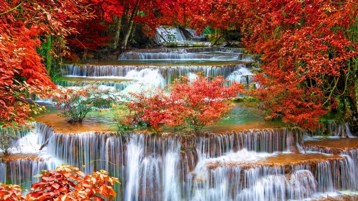 Tiered waterfall with red foliage