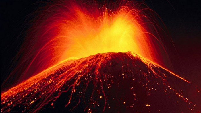 Volcano erupting with lava and ash