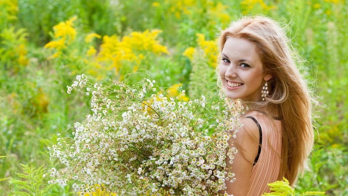 Girl with a bouquet of wildflowers