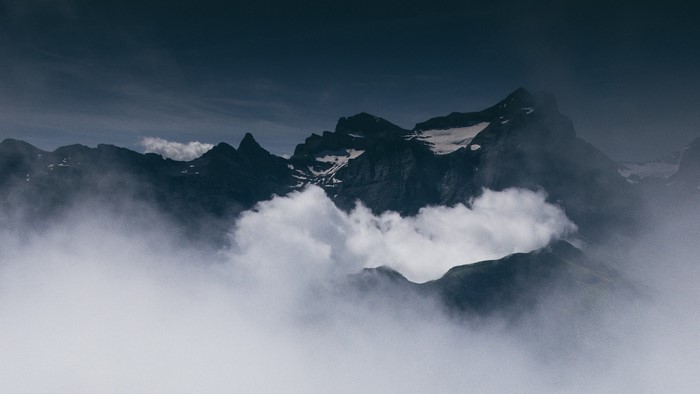 Mountain peaks shrouded in clouds