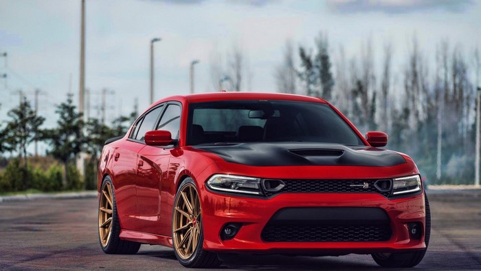 Red Dodge Charger with gold rims
