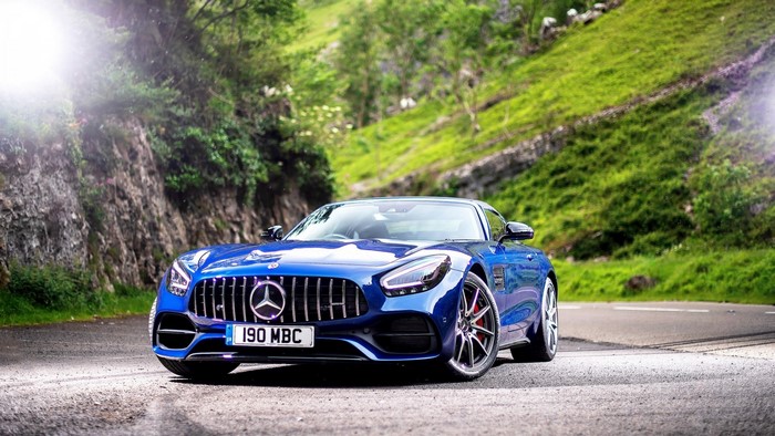 Blue Mercedes-AMG GT 2019 on a road