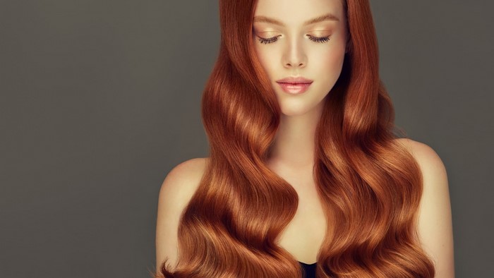 Red-haired woman with wavy hair