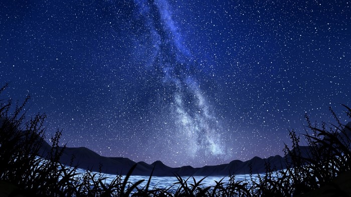 Milky Way over a lake and mountains