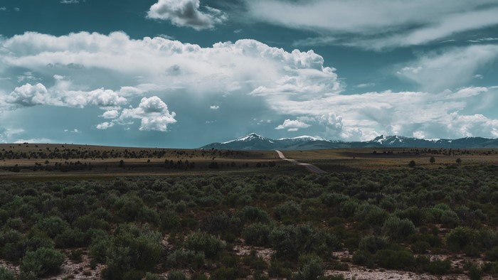 Desert landscape with mountains and clouds