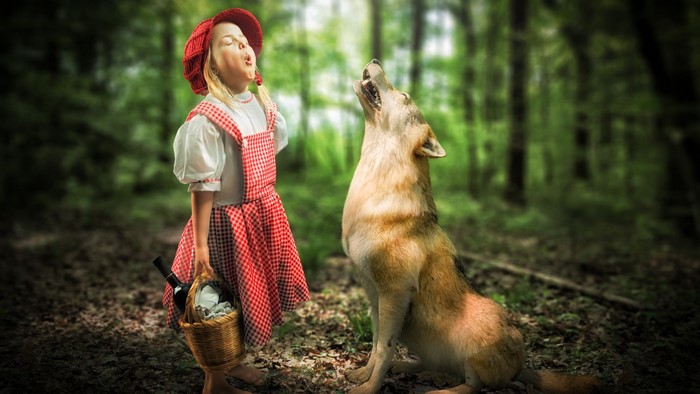 Little Red Riding Hood and a wolf in a forest