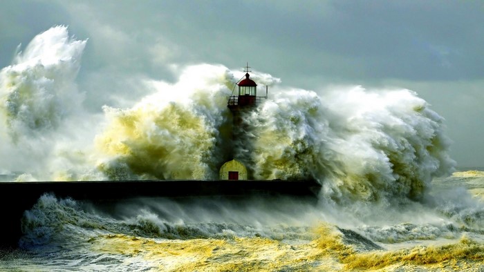 Lighthouse battered by massive storm waves