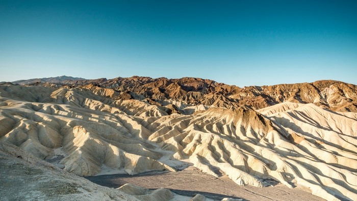 Badlands landscape under a clear blue sky