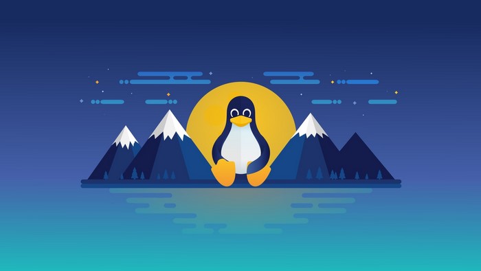 Tux the Penguin in front of a yellow moon and mountains
