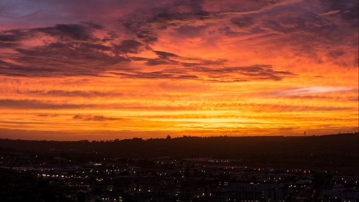 Sunset over a city skyline