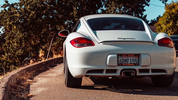 White Porsche Cayman on a Sunny Day