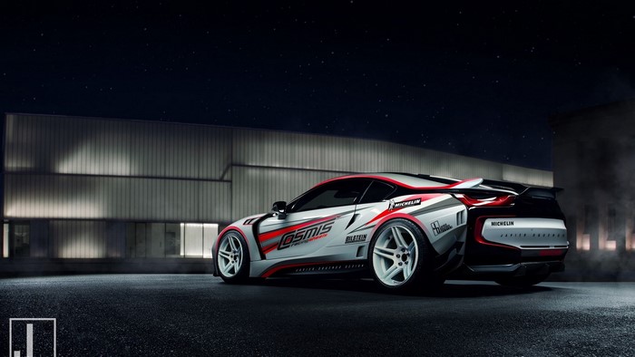Sports car with racing livery at night