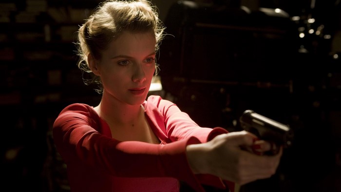 Melanie Laurent holding a pistol