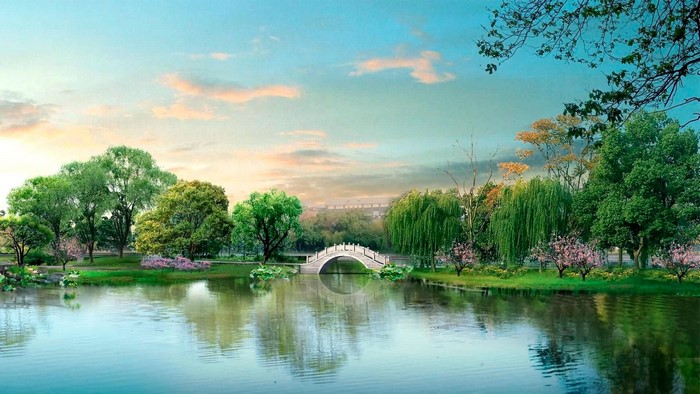 A scenic park with a lake and a bridge