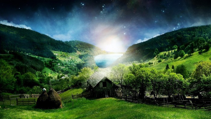 Starry sky over a mountain lake and village